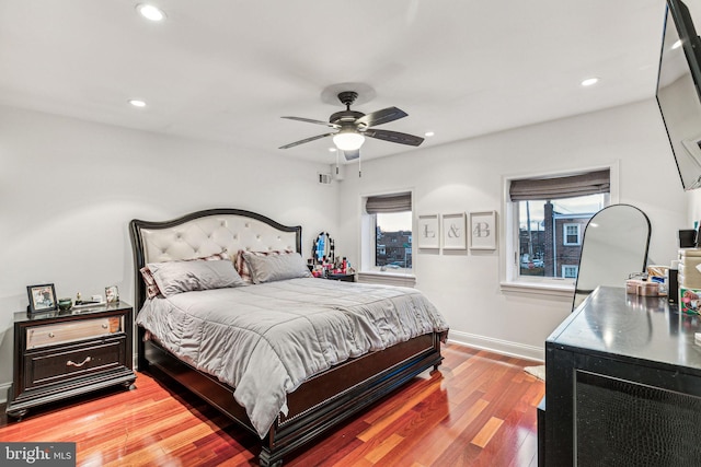 bedroom with ceiling fan and hardwood / wood-style floors