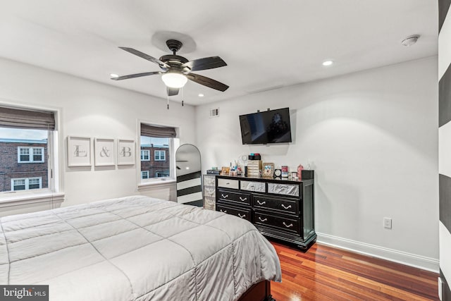 bedroom featuring ceiling fan and hardwood / wood-style flooring