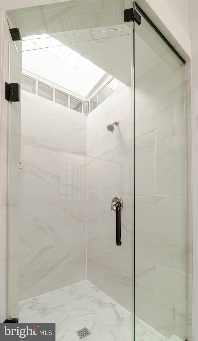 bathroom featuring an enclosed shower