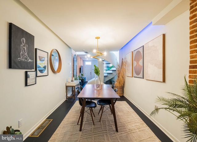 corridor featuring a notable chandelier