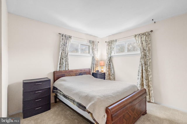 bedroom featuring light colored carpet