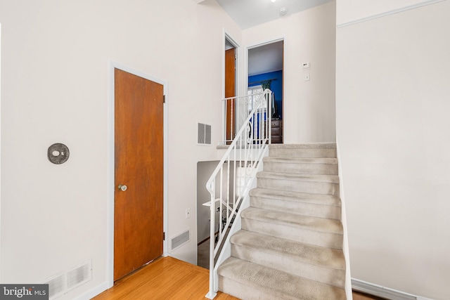 stairs with wood-type flooring