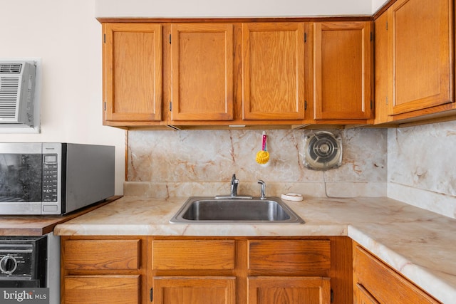 kitchen with sink and decorative backsplash