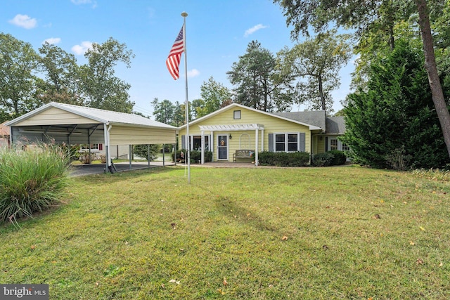 view of front of property with a front yard and a carport