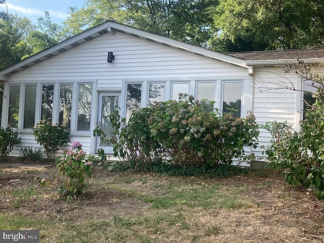 view of front facade with a sunroom