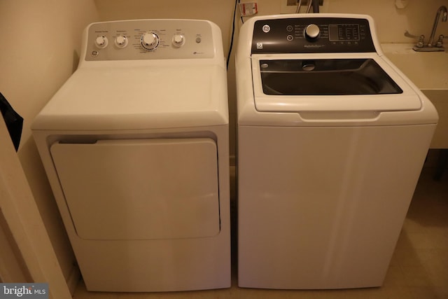 laundry area with separate washer and dryer