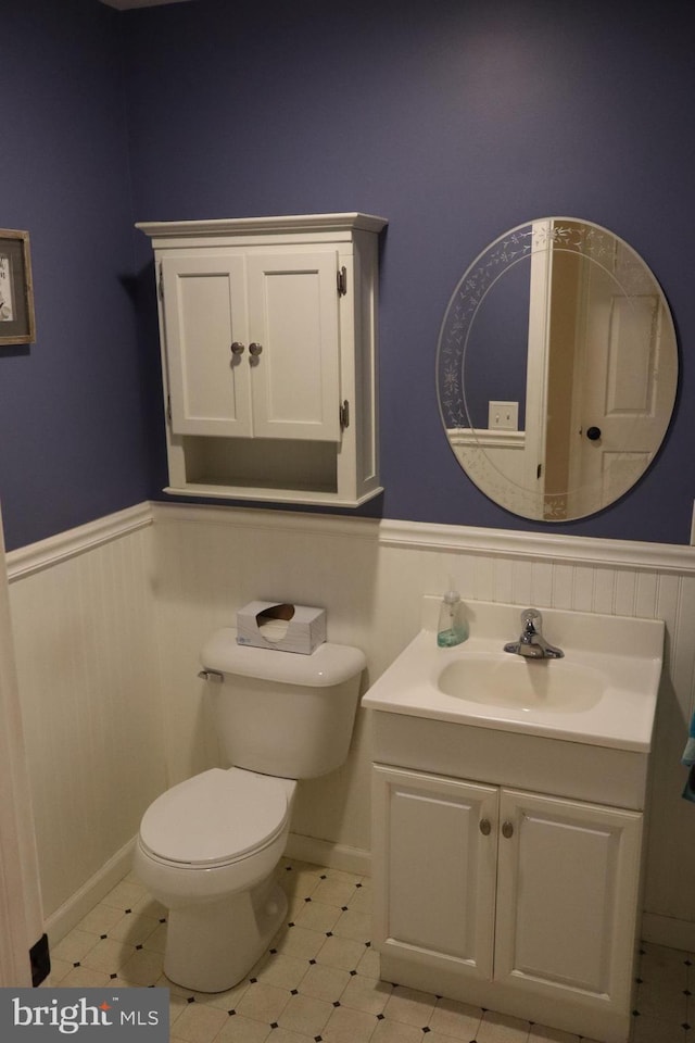 bathroom with toilet and vanity