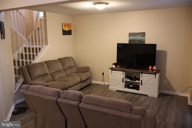 living room with dark hardwood / wood-style flooring