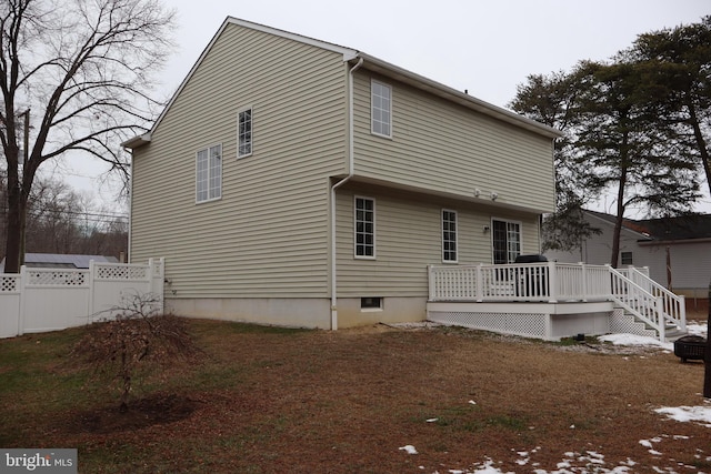 rear view of property with a deck