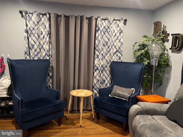 sitting room with hardwood / wood-style floors