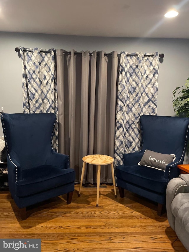 sitting room featuring hardwood / wood-style floors