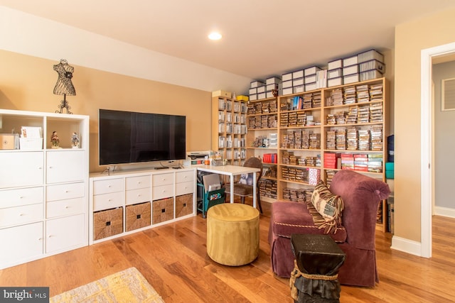 sitting room with light hardwood / wood-style flooring