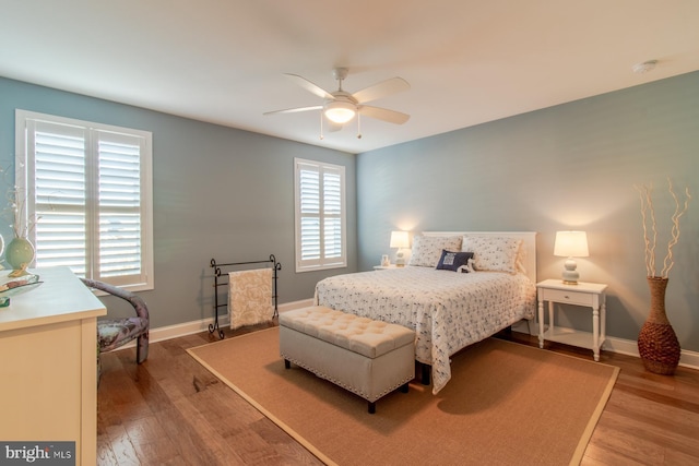 bedroom with hardwood / wood-style floors and ceiling fan