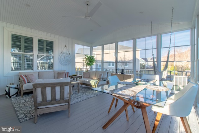 sunroom / solarium featuring ceiling fan and lofted ceiling