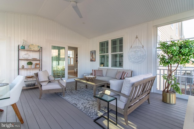 sunroom featuring vaulted ceiling, a wealth of natural light, and ceiling fan