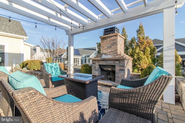 view of patio / terrace featuring an outdoor living space with a fireplace and a pergola