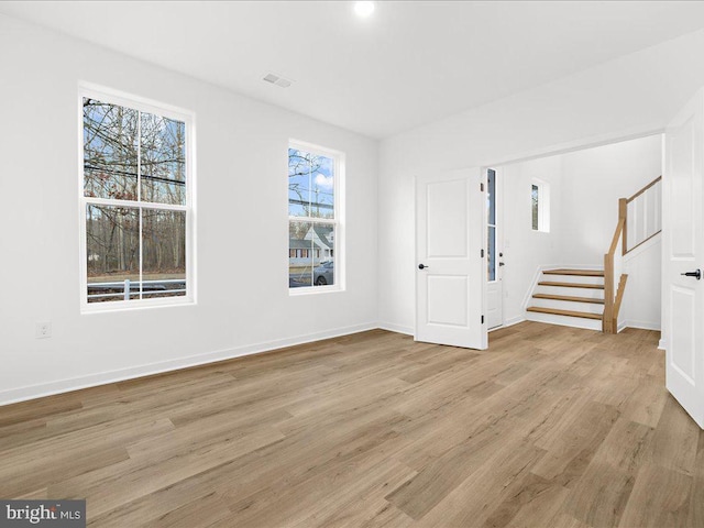 interior space featuring light hardwood / wood-style flooring and plenty of natural light