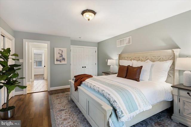 bedroom with dark wood-type flooring