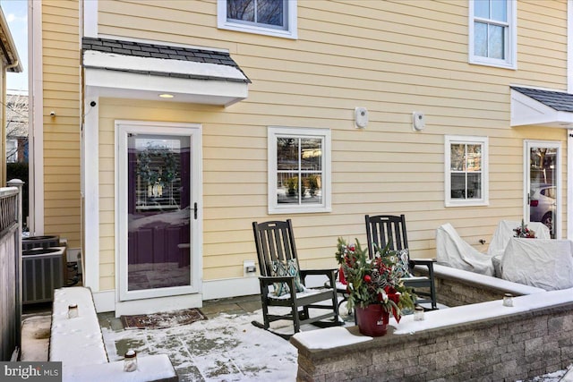 back of property with an outdoor living space, a patio, and central AC unit