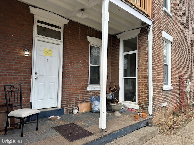 doorway to property featuring ceiling fan