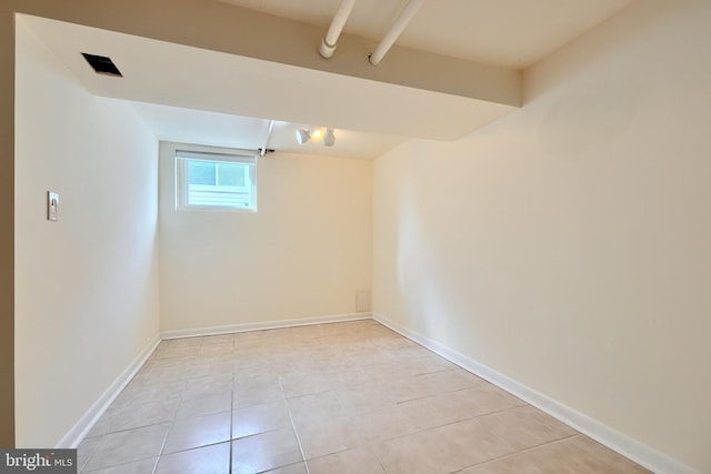 unfurnished room featuring light tile patterned floors