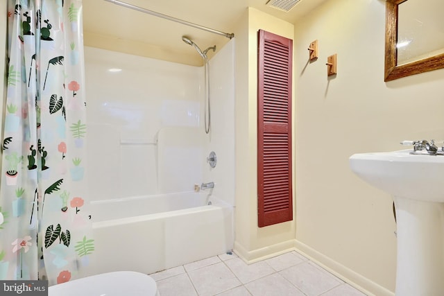 full bathroom with tile patterned flooring, shower / bath combo, toilet, and sink