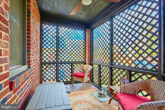 sunroom / solarium with ceiling fan