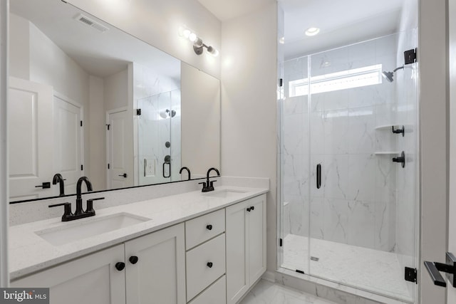 bathroom with vanity and an enclosed shower