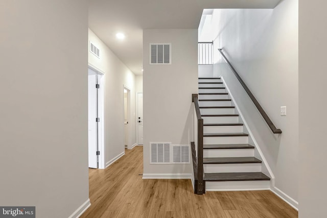 staircase featuring hardwood / wood-style floors