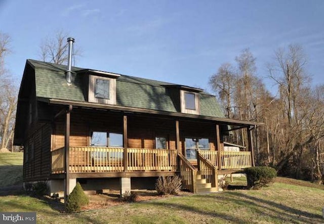 view of front of home with covered porch and a front lawn