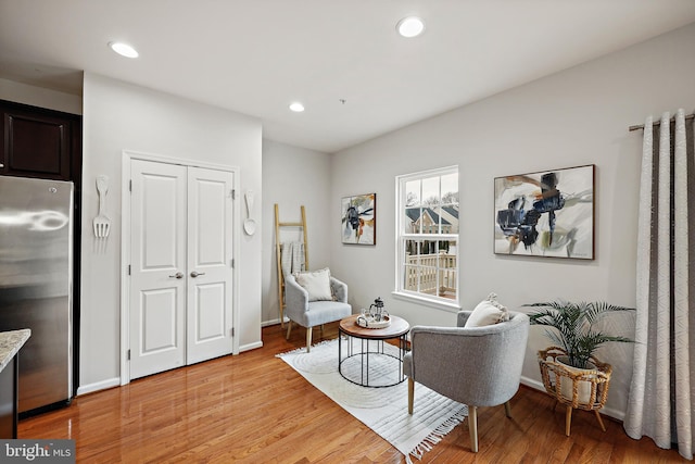 sitting room featuring light hardwood / wood-style floors