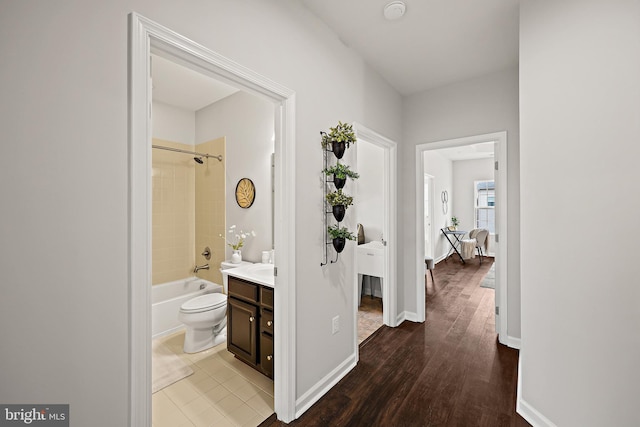 hallway with wood-type flooring