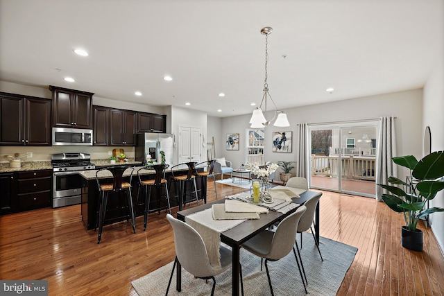 dining space featuring dark wood-type flooring