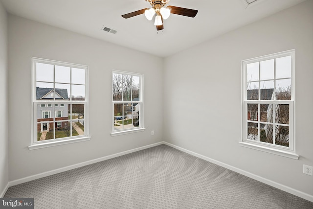 carpeted empty room with ceiling fan