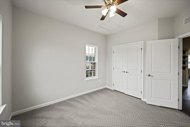 unfurnished bedroom featuring ceiling fan and carpet floors