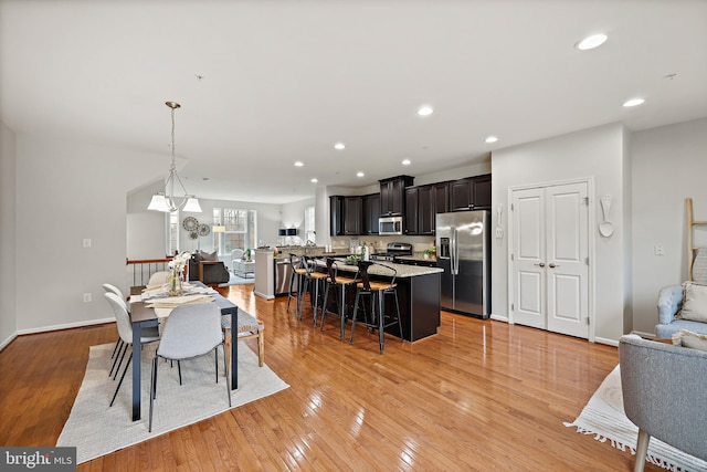 dining area with light hardwood / wood-style floors