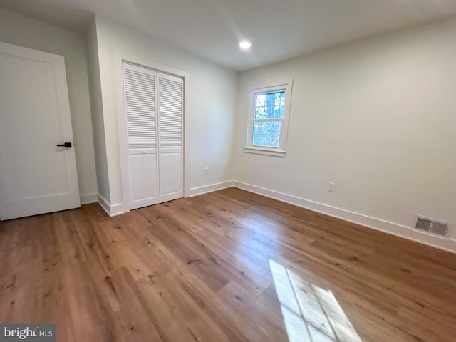 unfurnished bedroom with light hardwood / wood-style floors