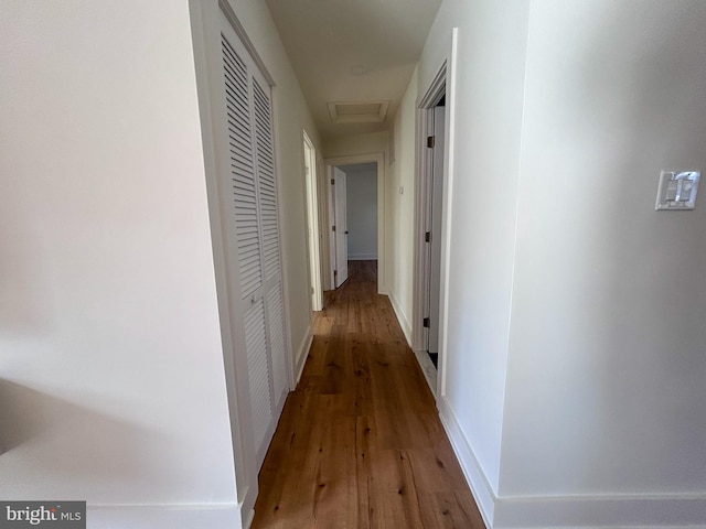 hallway featuring hardwood / wood-style flooring