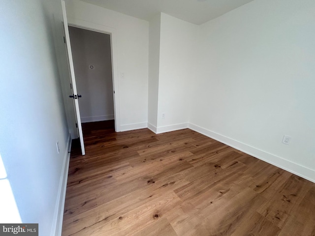 empty room featuring hardwood / wood-style flooring