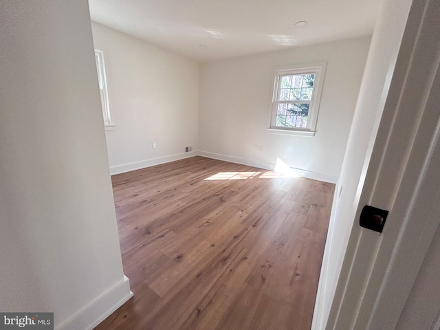 unfurnished room with light hardwood / wood-style flooring