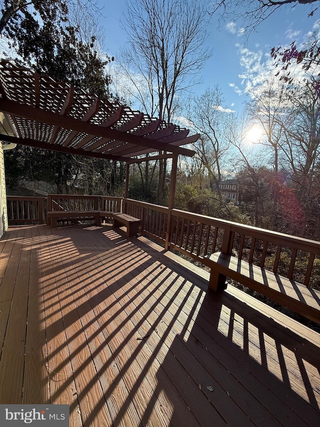 wooden terrace with a pergola