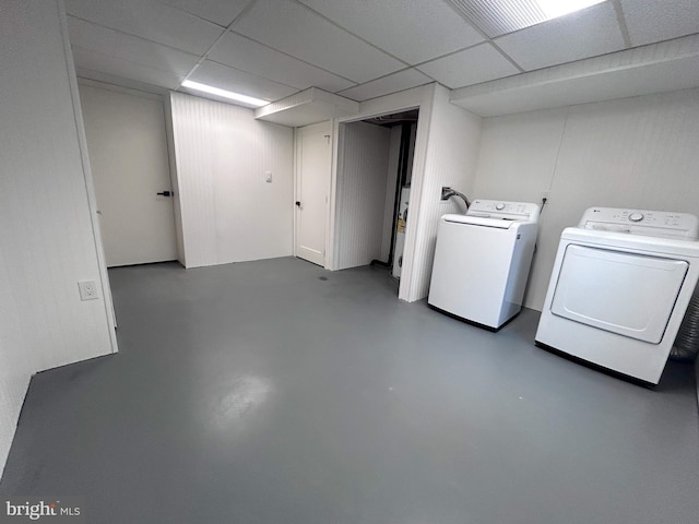 clothes washing area featuring washer and clothes dryer