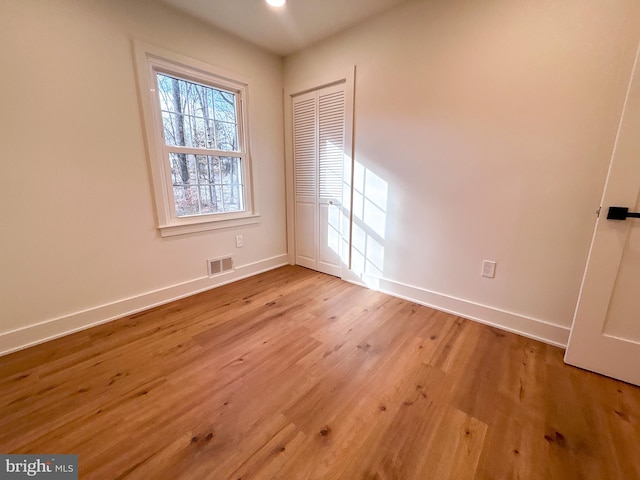 spare room featuring light hardwood / wood-style floors