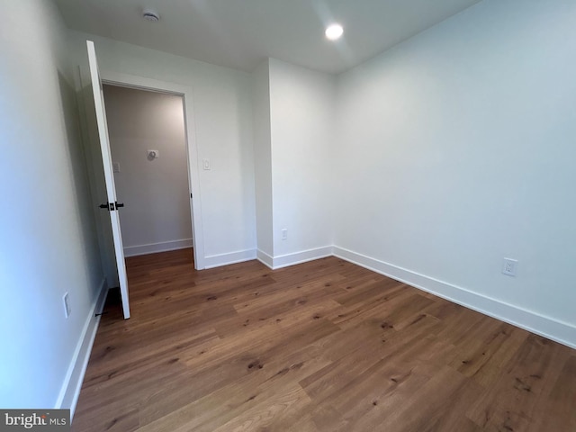 spare room featuring hardwood / wood-style flooring