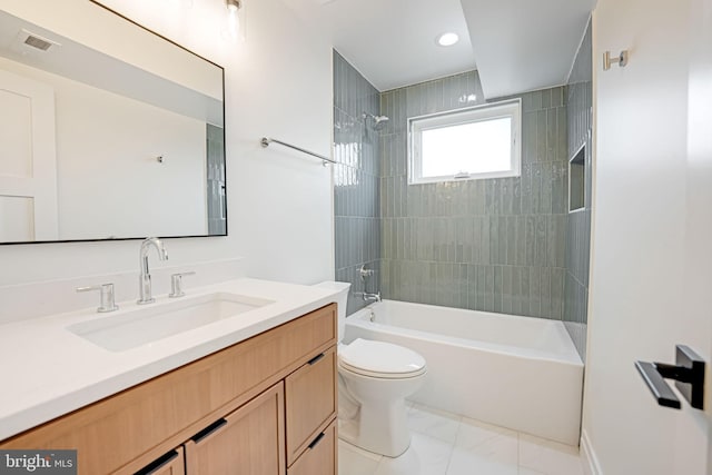 bathroom with toilet, vanity, visible vents, and shower / bathtub combination