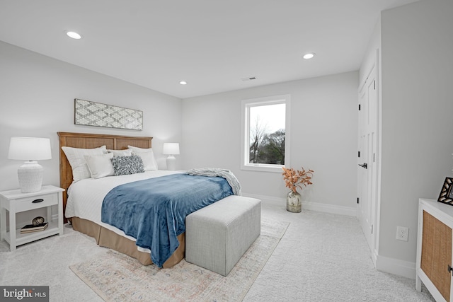 carpeted bedroom with recessed lighting, visible vents, and baseboards