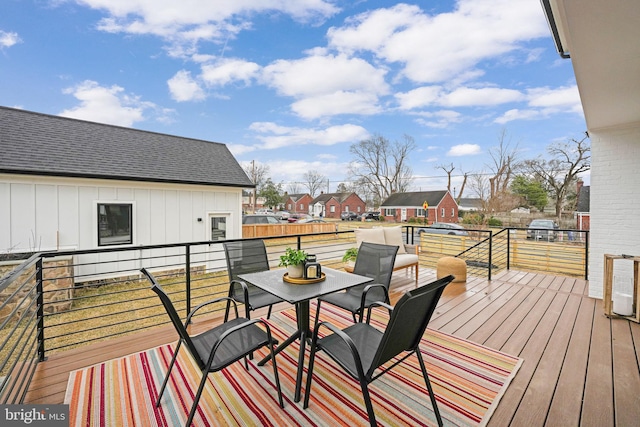 wooden deck with a residential view