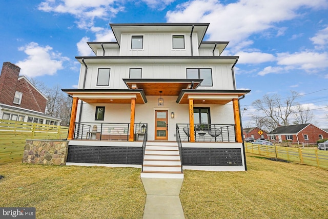 view of front of home featuring board and batten siding, a front yard, a porch, and fence