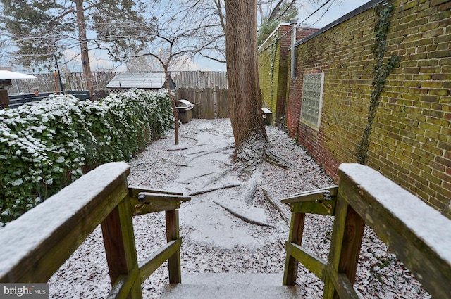 view of yard layered in snow