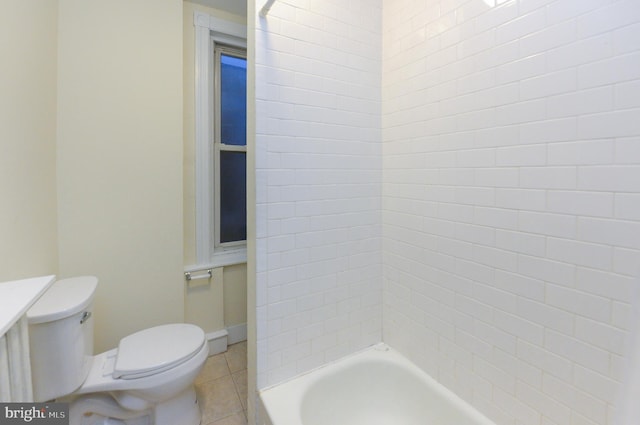 bathroom with tile patterned floors, shower / bath combination, and toilet